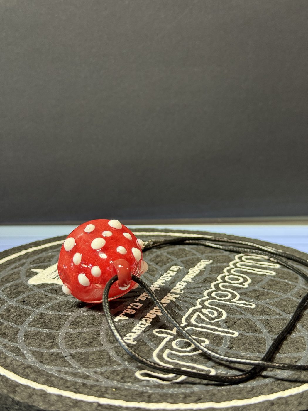 Red mushroom pendant at Mr. Wigz Smoke Shop